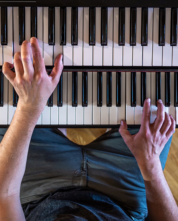 Man playing keyboards